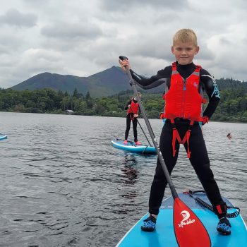 Kids doing sup water sport in lakes