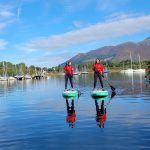 Couple paddleboarding on Derwentwater Keswick