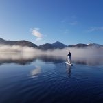 Paddleboarding on Derwentwater on crisp winter morning